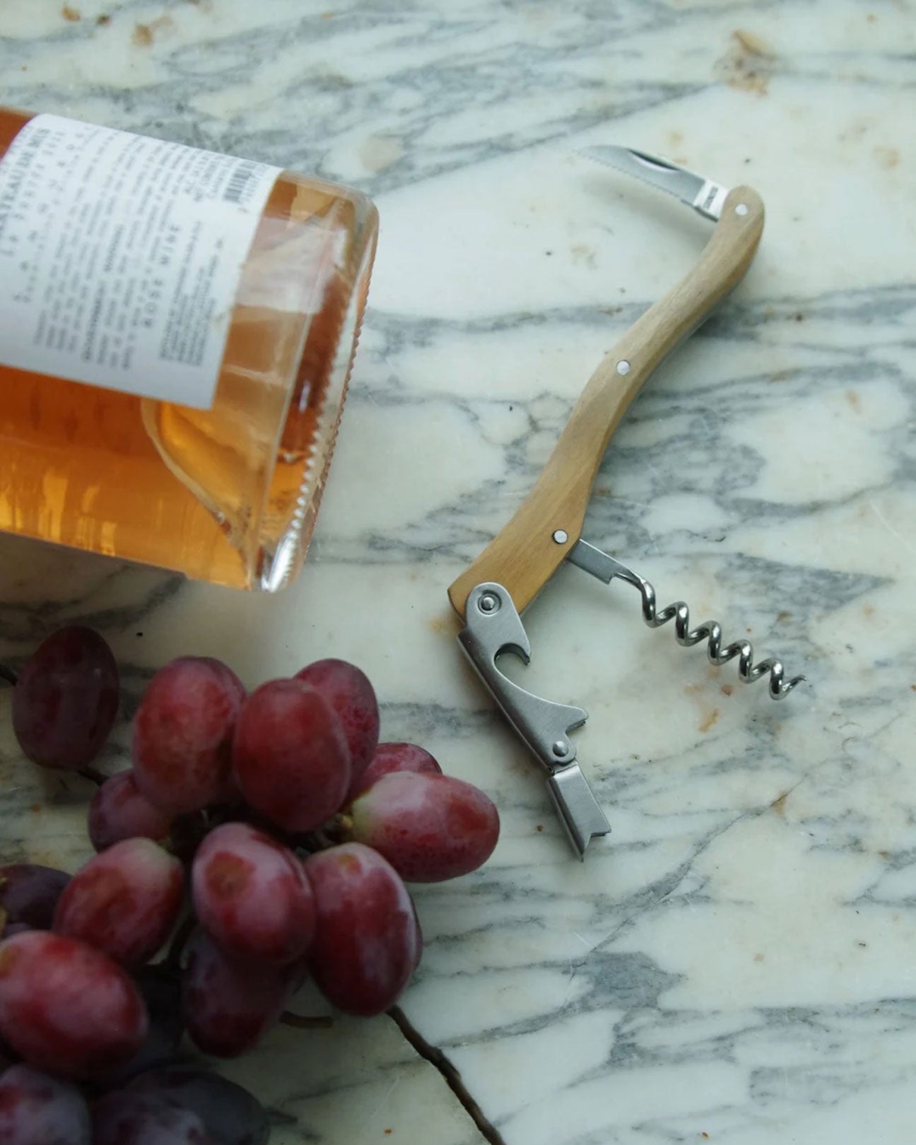 9 CHRISTOPHER Corkscrew with Leather Sleeve in Olivewood available at Lahn.shop